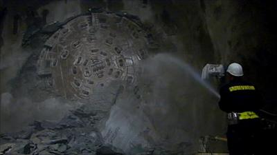 Drill breaks through rock