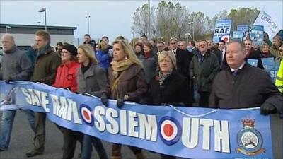 Protesters carrying banner