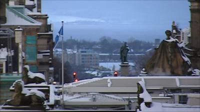 Scottish flag flying in city