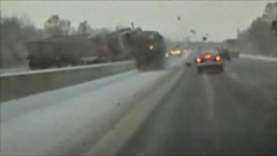 Lorry crashes through central barrier
