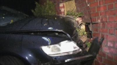 The car crashed into the living room of the house