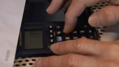 Woman using a calculator
