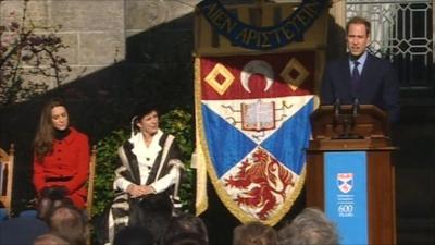 Prince William gives a speech while Kate Middleton and others look on