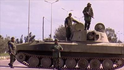 Armed men outside the Libyan city Zawiya