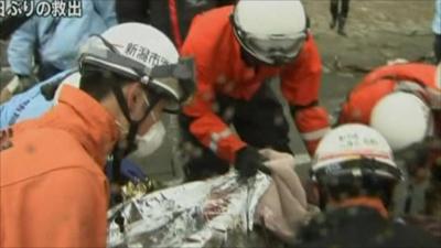 Rescuers with survivor