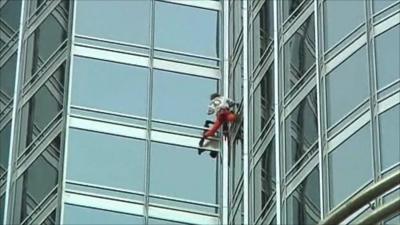 The French climber scales the skyscraper