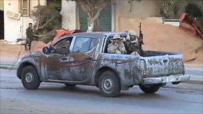Armed men in a vehicle