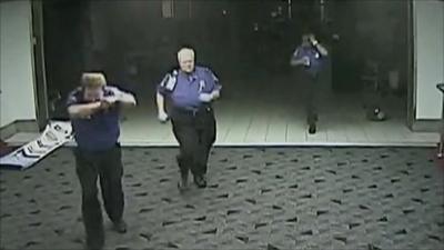 CCTV shows security running for cover