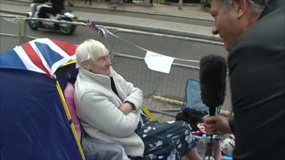 Woman camping outside Westminster Abbey