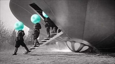 Aliens with green heads leave a flying saucer