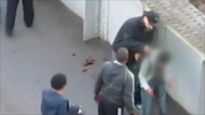Injured man being mugged