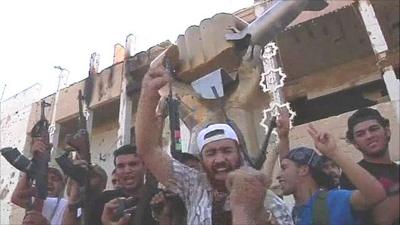 Rebels at Col Muammar Gaddafi's compound on Tuesday