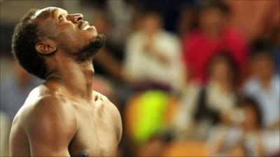 Usain Bolt reacts to his disqualification in the 100m final Daegu