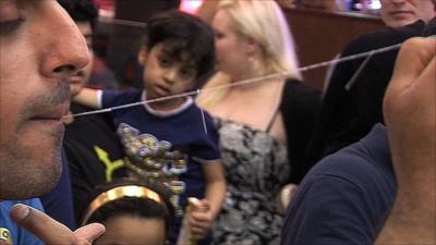 Pulling pins from his mouth