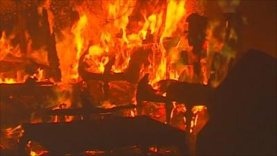 House on fire in Sirte, Libya