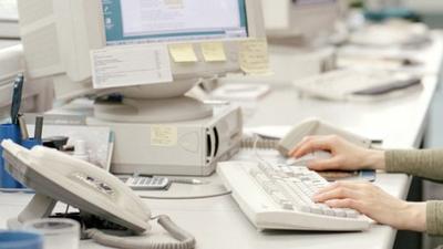 woman using computer at work