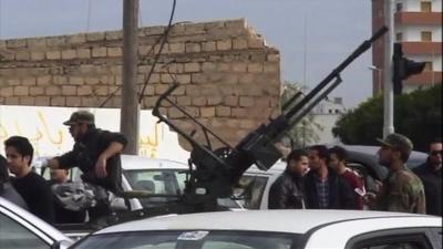 Car with gun on roof