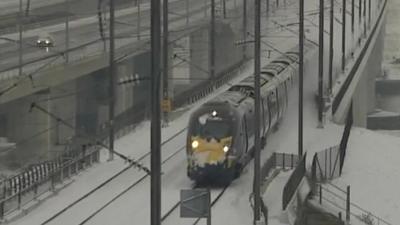 Train drives through the snow