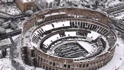 A snow covered colosseum in Rome