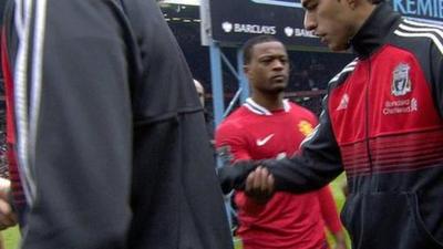 Suarez refuses Evra handshake