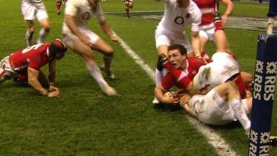 David Strettle's attempt to score a try is held up by George North