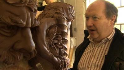 Alan Lamb next to one of his sculptures
