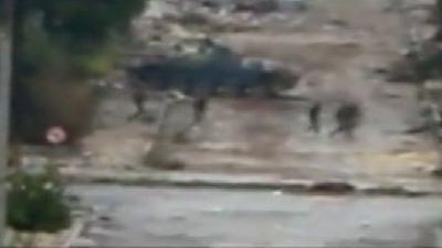 Tank and soldiers in Al Inshaat district in Homs, Wednesday