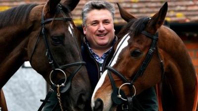 Trainer Paul Nicholls with Denman (left) and Kauto Star (right) at his stables in Ditcheat, Somerset.