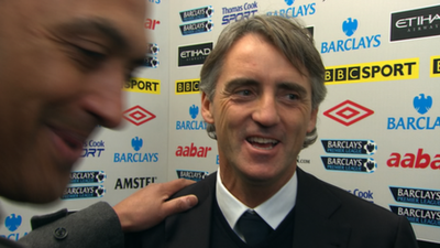 BBC reporter Damian Johnson and Manchester City's Roberto Mancini