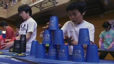 Children stacking cups