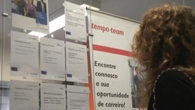 Woman looking at job adverts