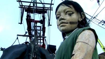 Giant puppet of girl