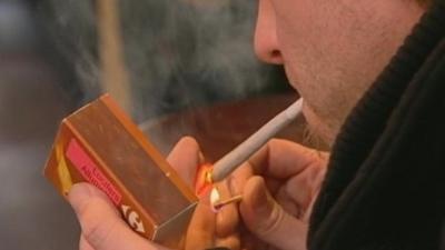 Man lighting up a joint