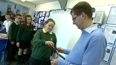 School pupils handing in their phones