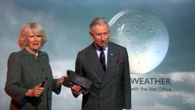 Prince Charles and Duchess of Cornwall present the weather