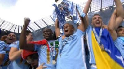 Manchester City lift the Premier League trophy