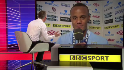 Gary Lineker (left, seated) interviews Manchester City captain Vincent Kompany