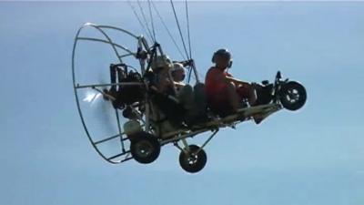 A paratrike in flight