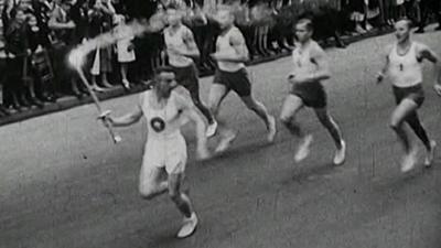 Archive footage of the torch relay