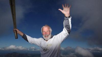 Sir Chris Bonington on the summit of Snowdon