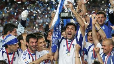 Traianos Dellas of Greece lifts the trophy