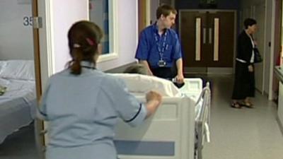 Hospital workers with a patient