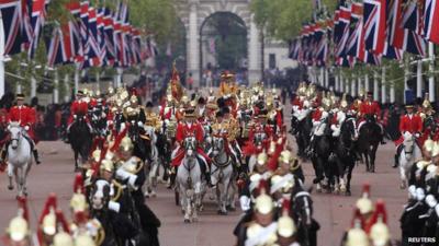 Royal Horseguards lead the Queen's carriage procession along The Mall