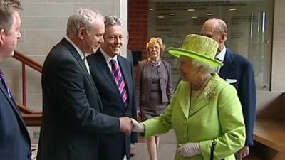 Sinn Fein first minister Martin McGuinness shakes hands with The Queen