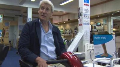 Jeremy Paxman on a mobility scooter