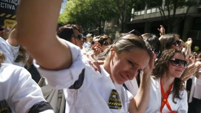 A doctor cries during a protest in front of the Health Ministry in Lisbon