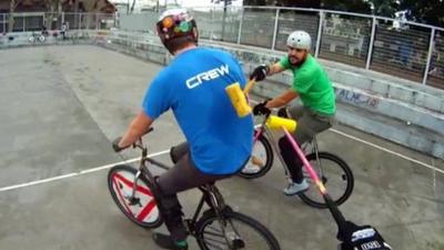 Bike polo players celebrating after a match