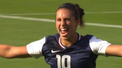 Carli Lloyd celebrates scoring against France