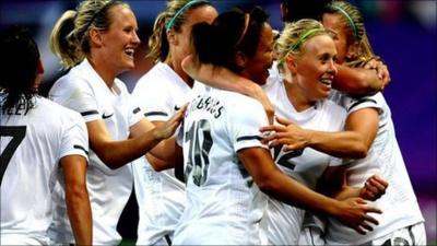 New Zealand players celebrate their second goal.