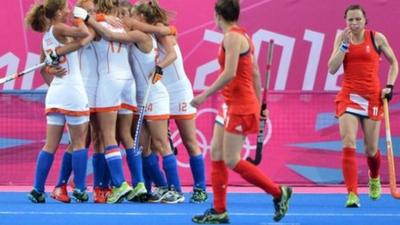 Dutch players celebrate scoring against Great Britain